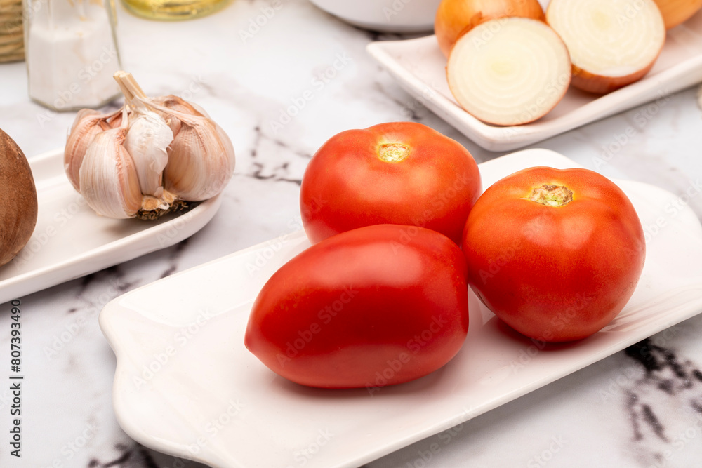 mise en place on table with assorted vegetables in white tableware with oil pepper vinegar and salt for salad and vegetarian and vegan meals mise en place on table with assorted vegetables in white tableware with oil pepper vinegar and salt for salad and vegetarian and vegan meals
