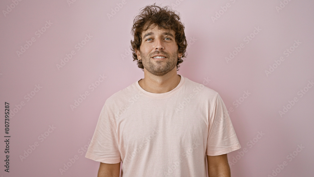 Handsome young hispanic man in casual clothing against a pink isolated background Handsome young hispanic man in casual clothing against a pink isolated background