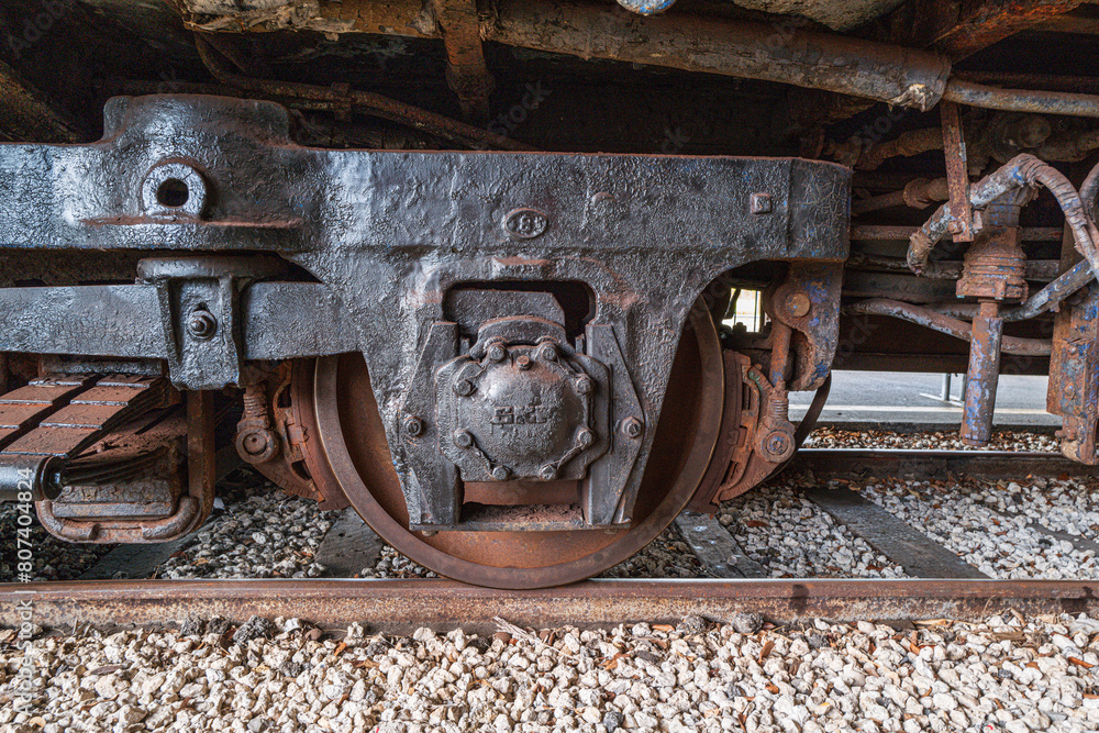 Steam train wheels on railroad track