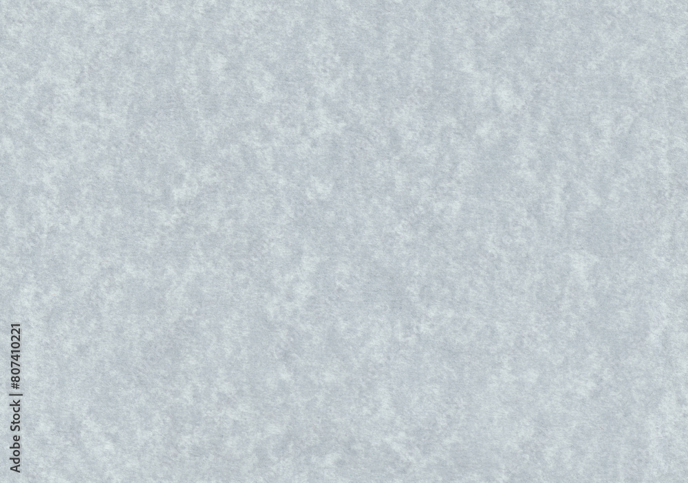 Seamless spotted noise grey paper texture. Smooth cardboard surface.
