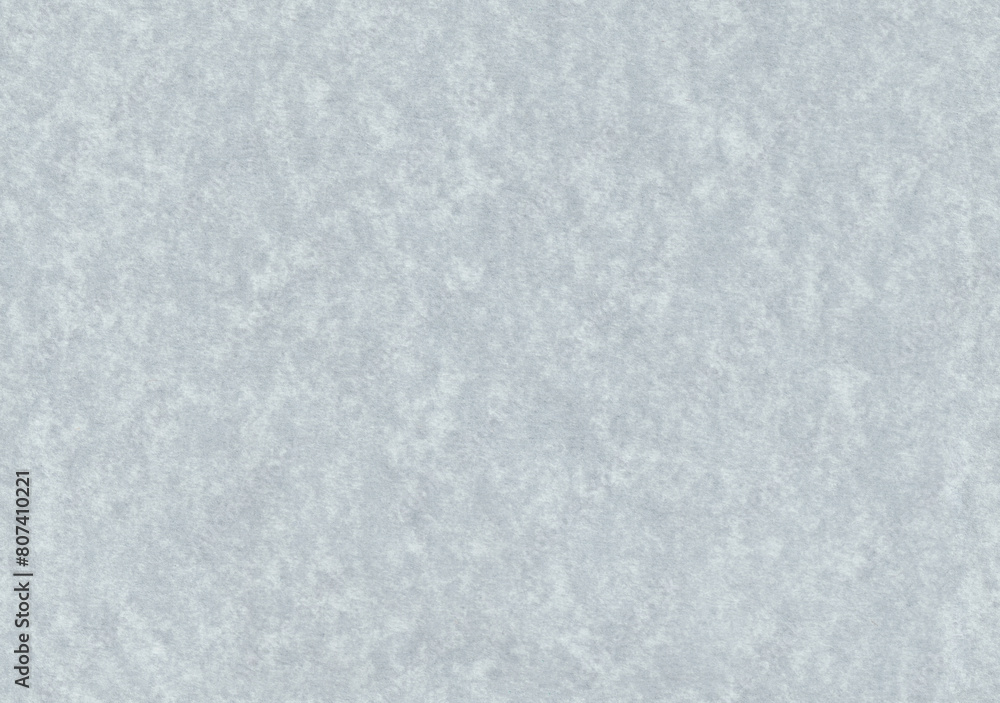 Seamless spotted noise grey paper texture. Smooth cardboard surface.