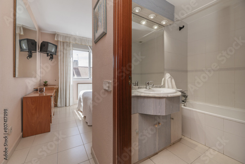 Wallpaper Mural Bathroom of a house with furniture with marble countertop and white porcelain sink with integrated beveled mirror in the bedroom anteroom Torontodigital.ca