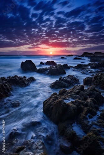 Dramatic sunset over rocky ocean coastline