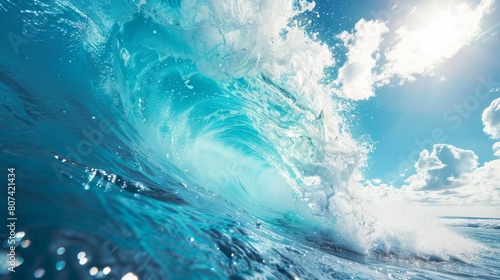 A large blue ocean wave rises against a bright sun in the background, creating a striking contrast of colors and energy.