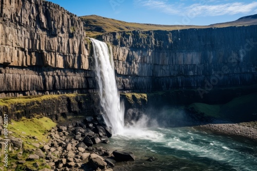Majestic waterfall cascading down rugged cliffs