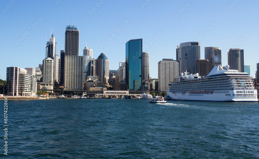Sydney skyline and cruise ship moored in harbour, Australia Sydney skyline and cruise ship moored in harbour, Australia