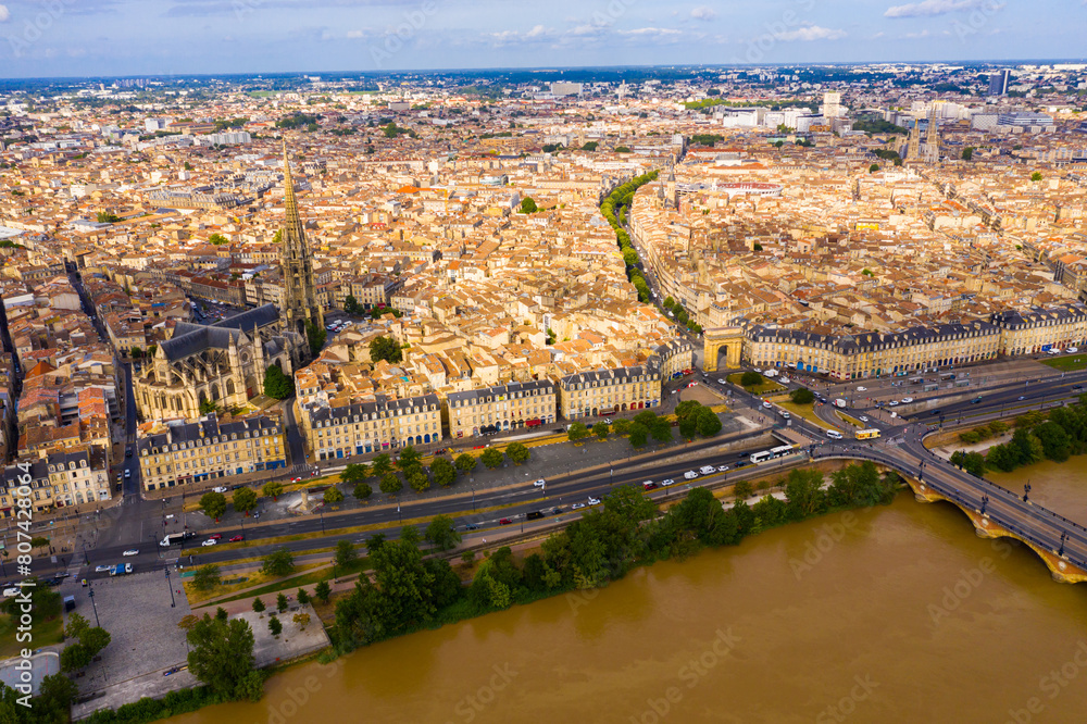 Fototapeta premium View from drone of modern cityscape of French port city of Bordeaux on river Garonne in summer
