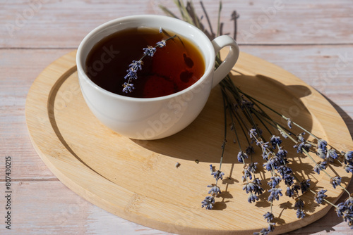 Lavender flowers with herbal cup of tea. Concept of Herbal medicine natural remedy. Organic relieving stress. Healthy beverage fresh delicious floral hot tea. Antispasmodic effect naturopathy concept photo
