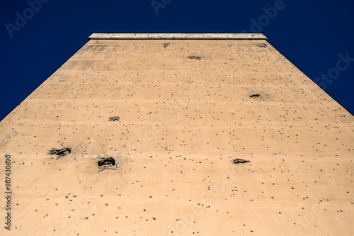 Holes of bullets and shells on the wall of resident building. Remnants of the war in Sarajevo, Bosnia and Herzegovina. A holes in the wall from shelling.