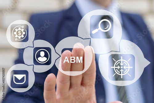Business man working on virtual touch screen presses abbreviation: ABM. Concept of Account Based Marketing ( ABM ). Business Web Marketing Technology.