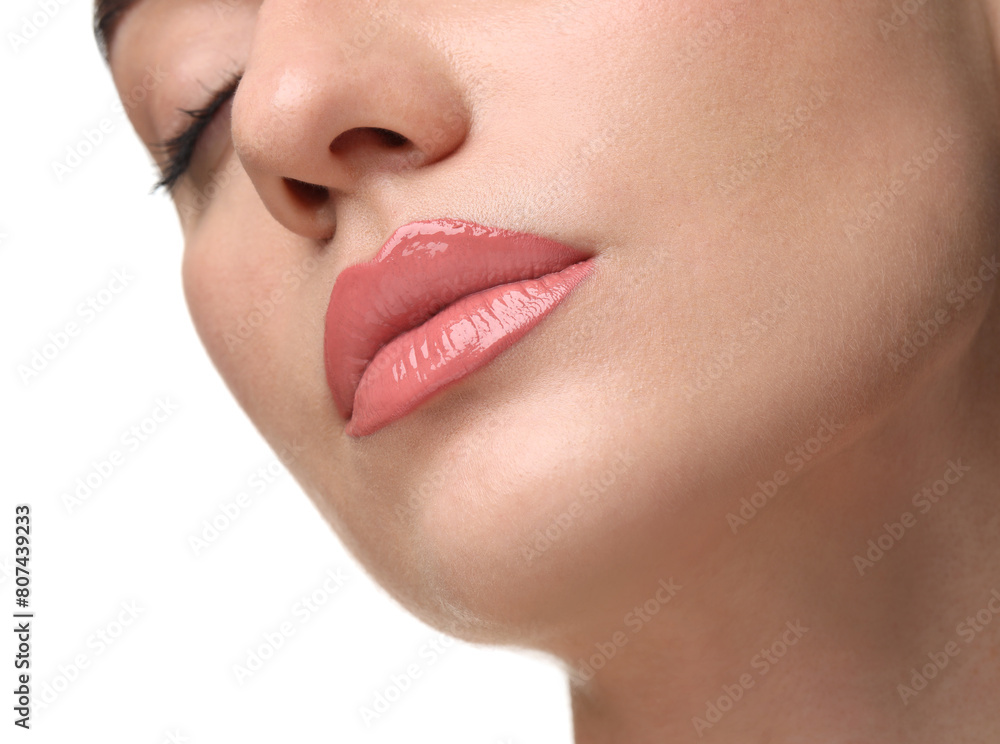 Obraz premium Woman wearing beautiful lip gloss on white background, closeup