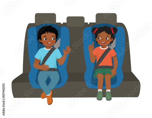 Cute little African kids sitting in car seat putting seat belt for safety