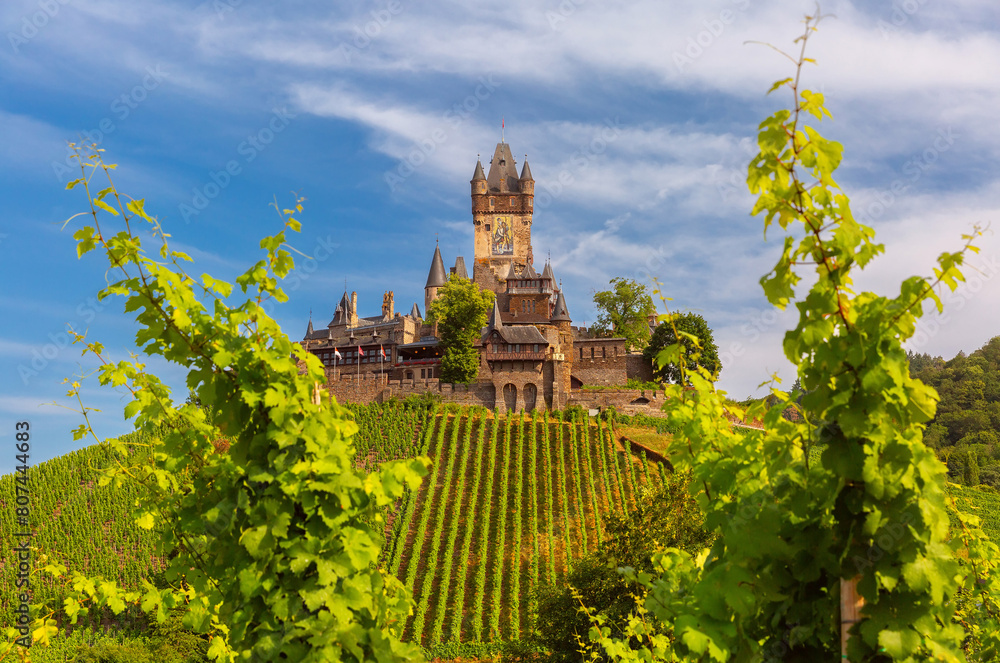 View of sunny Cochem with Reichsburg castle, beautiful town on romantic Moselle river, Germany