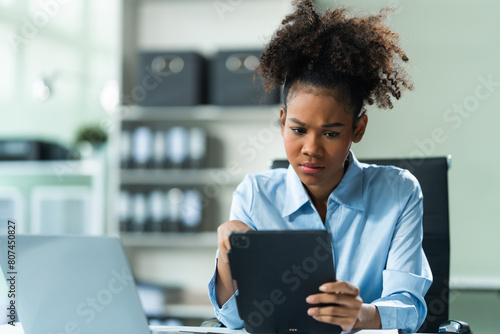 Photography A young African American woman with Afro brown hair in a modern office experiencing panic, business-related stress, frustration, and anxiety