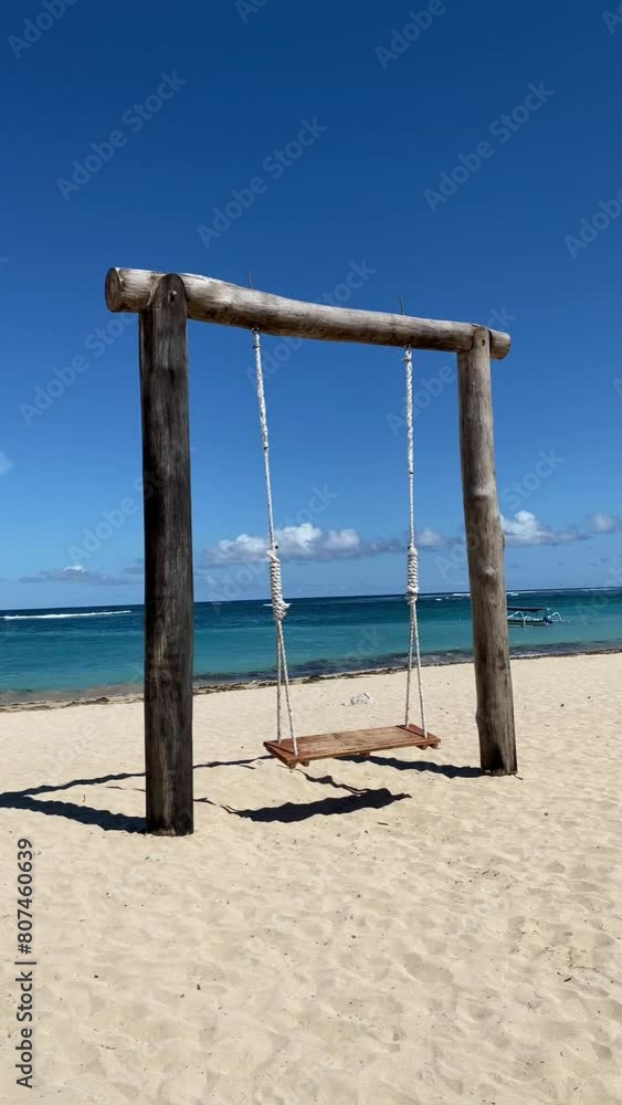 Swing and pathways at beach against blue sky Swing and pathways at beach against blue sky