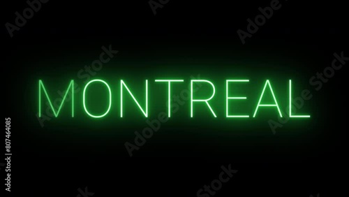 Flickering neon green glowing montreal text animated on black background photo