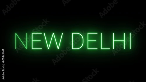 Flickering neon green glowing new delhi text animated on black background photo