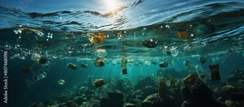 Underwater view of the sea with lots of trash, Plastic bottles floating in the water. Plastic pollution concept. © WaniArt