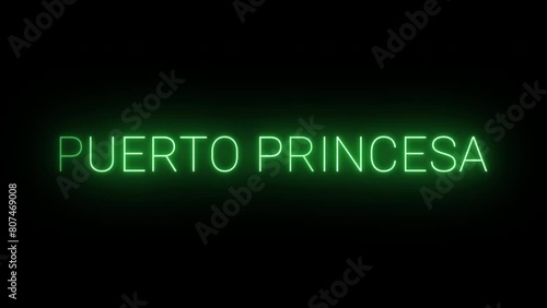Flickering neon green glowing puerto princesa text animated on black background photo