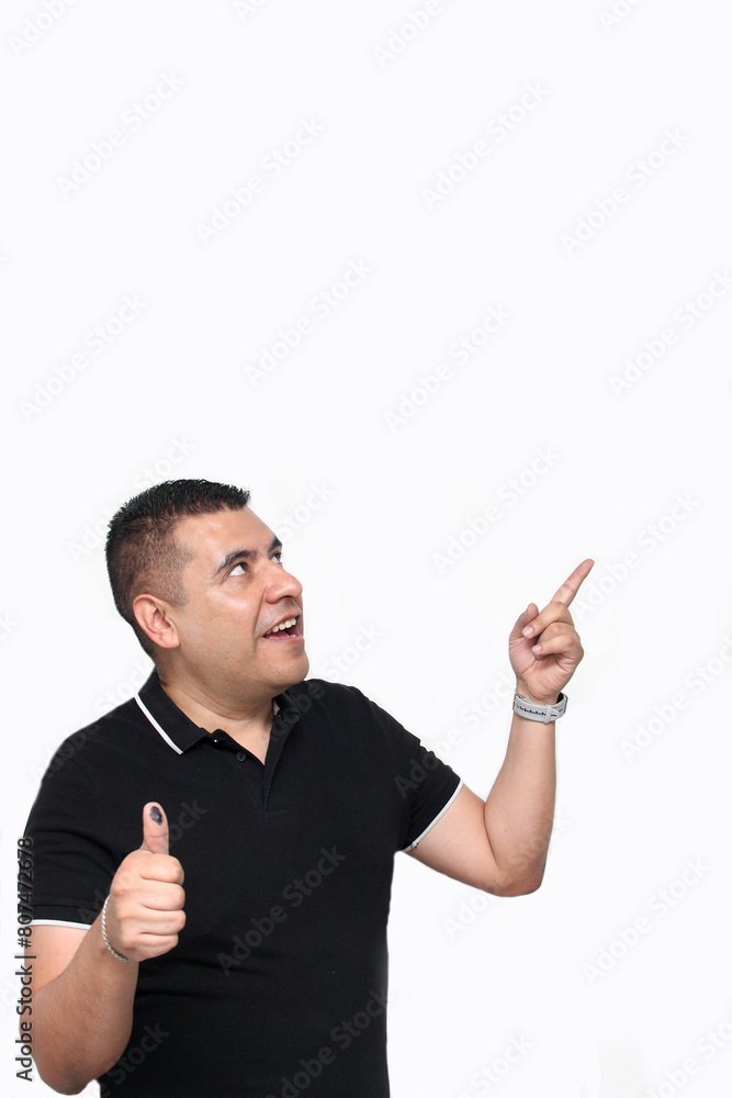 Latino adult man shows his thumb inked with indelible electoral ink after exercising his right to free and secret vote Latino adult man shows his thumb inked with indelible electoral ink after exercising his right to free and secret vote