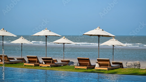 Landscape nature views, Relaxing chairs on beach and swimming pool.