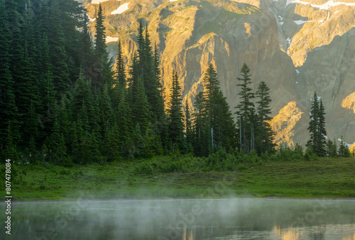 Fog Dances Across Flat Surface of Pond at Klapatche Park photo