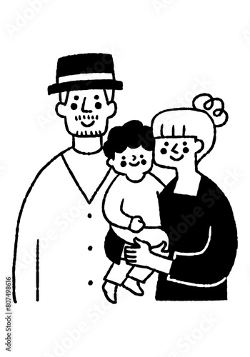 A family of three, a mother and father holding their son_2