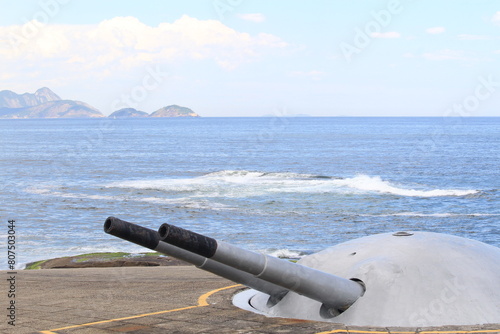 Copacabana defense turret cannons on a Copacaban fort with islands on the background