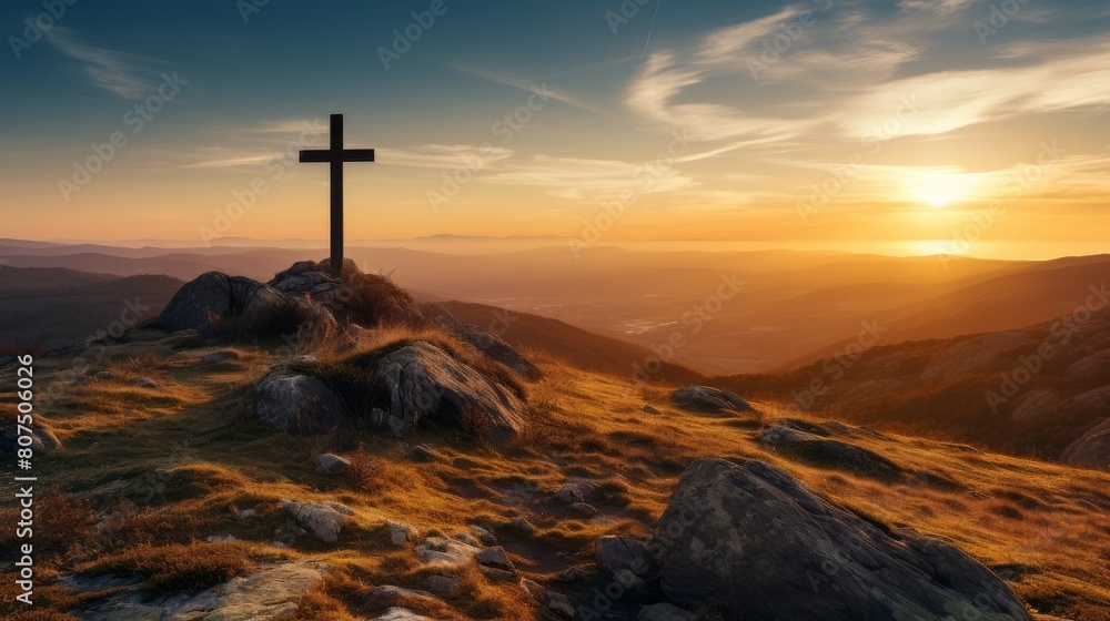 Dramatic sunset over a cross on a rocky mountain