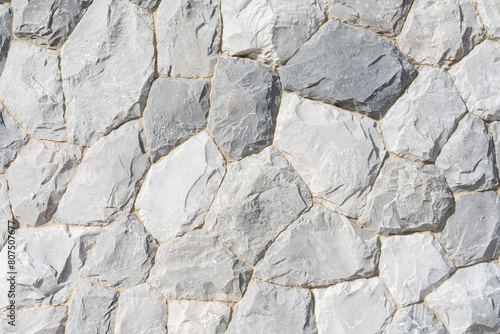 Full frame of natural stone wall. Rock background texture  wall background  stone  abstract. A beautiful stone wall constructed from grey stones.