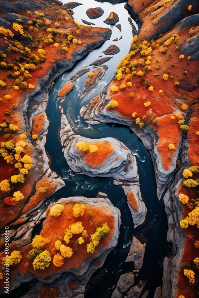 Aerial view of a winding river through a vibrant autumn landscape Aerial view of a winding river through a vibrant autumn landscape