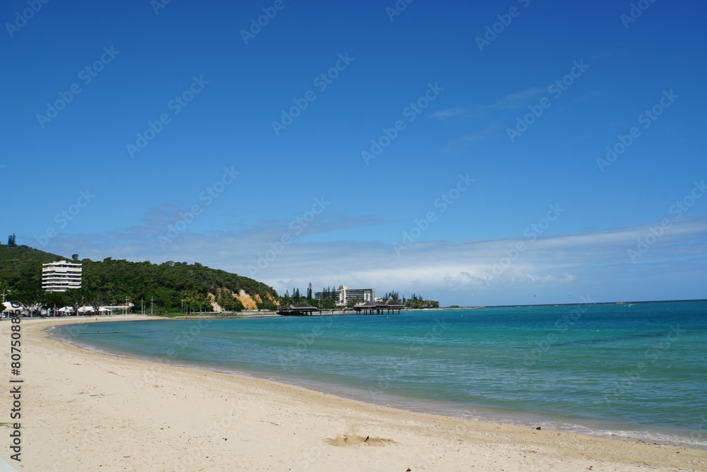 Plage de l'Anse Vata Beach with Blue Sky - New Caledonia Plage de l'Anse Vata Beach with Blue Sky - New Caledonia
