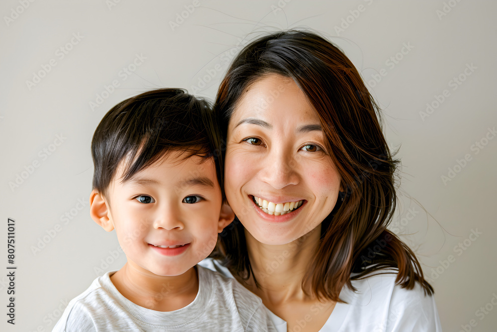 Mother and child smiling looking at camera on white background Mother and child smiling looking at camera on white background