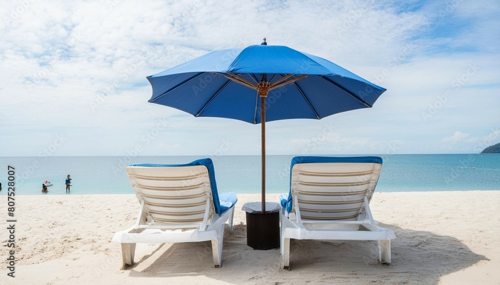 blue umbrella and sea facing chairs under Blue sky, Summer days in beach blue umbrella and sea facing chairs under Blue sky, Summer days in beach