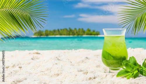 Fresh cold cocktail on tropical beach with palms and bright sand. Summer sea vacation and travel concept