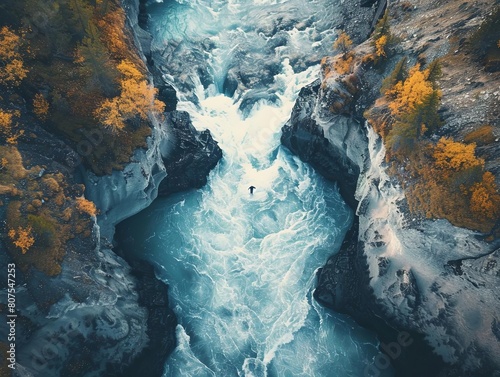 Transform a Drone Photography snapshot of a lone figure crossing a rushing river into a mesmerizing digital artwork