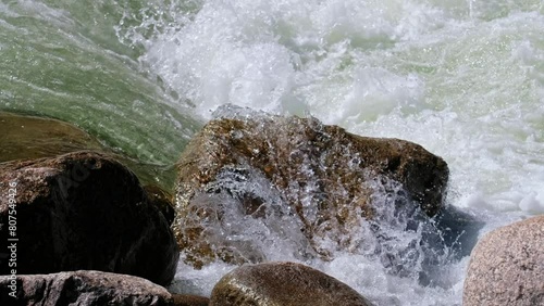 Video of Altai river Chulyshman. Boulders in river rapids. Boulders are on foreground photo