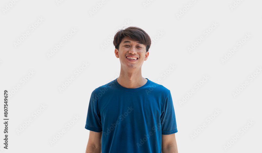 Young man in blue t-shirt smiling happily isolated on gray background. Young man in blue t-shirt smiling happily isolated on gray background.