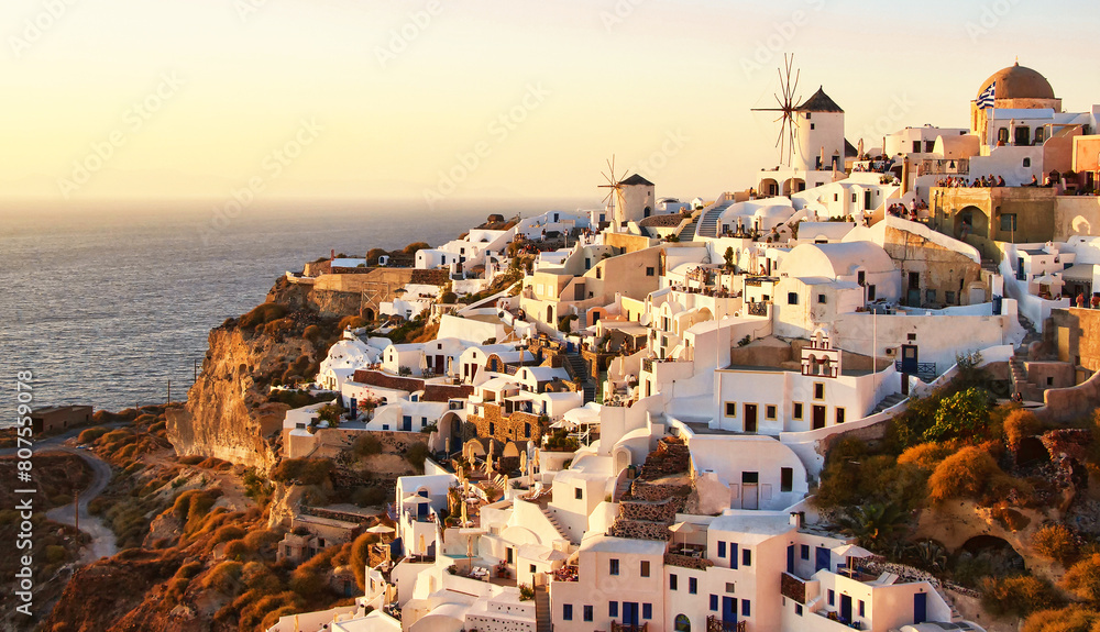 Obraz premium Panoramic landscape in Oia city on Santorini island, Greece at sunset