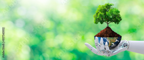 Fototapeta Naklejka Na Ścianę i Meble -  Robot Hand holding tree with half globe on Sunlight and Green grass background. Artificial Intelligence, World Environment, Eco, and Earth Day Concept. Elements furnished by NASA.