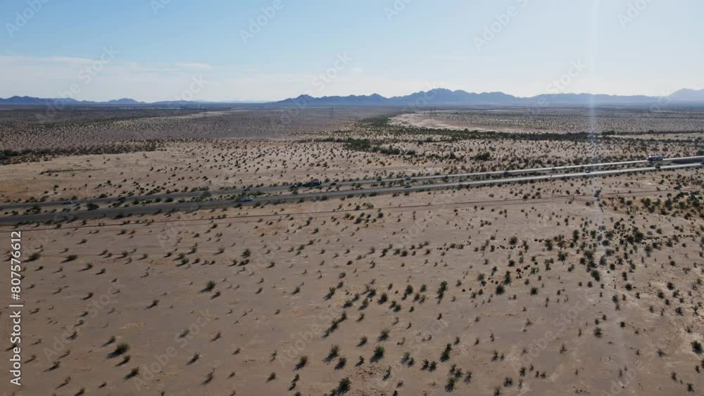 Aerial View Of Vehicles Driving Along Highway Through Arizona Desert, Wide Shot Aerial View Of Vehicles Driving Along Highway Through Arizona Desert, Wide Shot