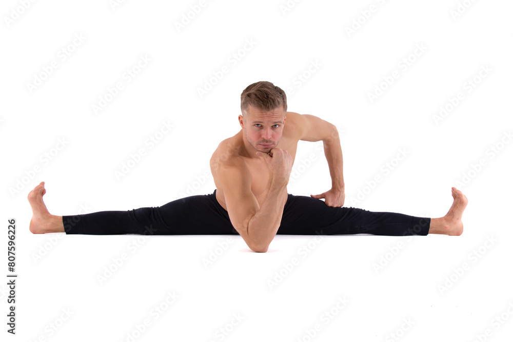 A handsome young man with an athletic body is doing fitness and yoga. White background. A handsome young man with an athletic body is doing fitness and yoga. White background.