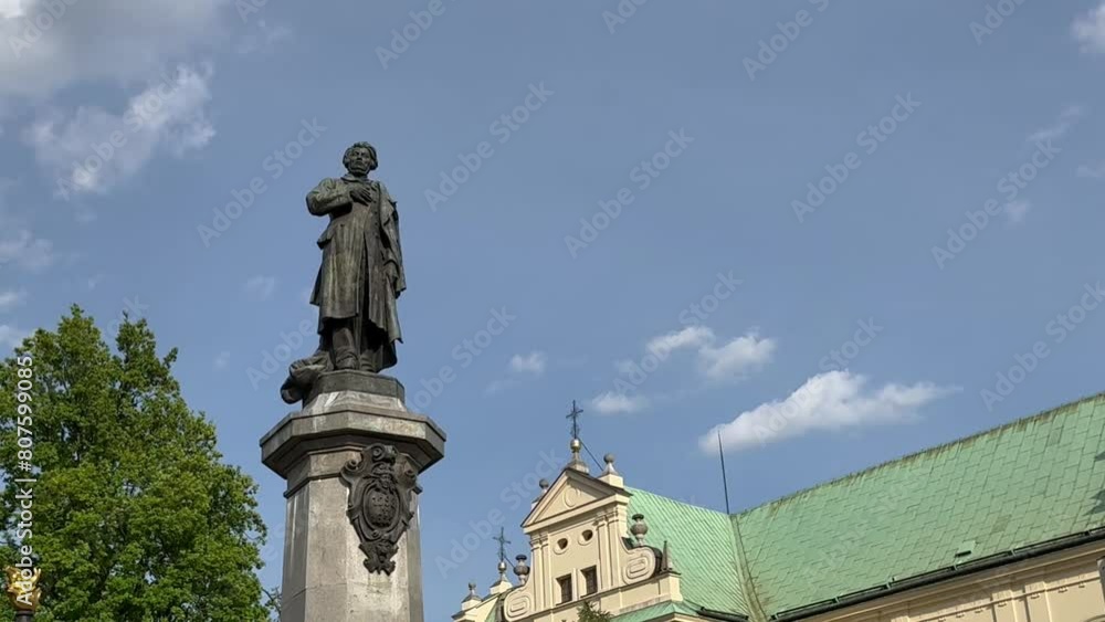 Warsaw, Poland - May 2, 2024, monument to Adam Mickiewicz near the church of the Assumption of the Virgin Mary and of St. Joseph Warsaw, Poland - May 2, 2024, monument to Adam Mickiewicz near the church of the Assumption of the Virgin Mary and of St. Joseph
