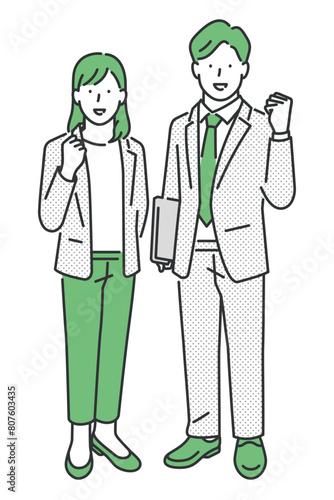 ガッツポーズする全身のスーツの女性と男性