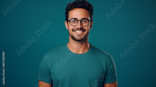  Smiling millennial male customer posing with confidence on solid colored background. Professional headshot portrait of a young man in glasses photo
