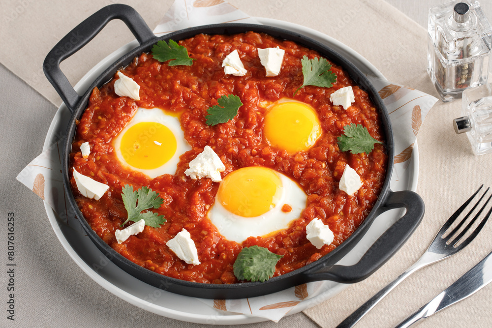 a pan of food with eggs and cheese a pan of food with eggs and cheese