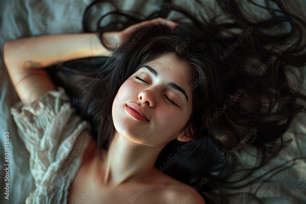 Sleeping images, A beautiful young woman is sleeping on the bed and her beautiful hair is spread Sleeping images, A beautiful young woman is sleeping on the bed and her beautiful hair is spread
