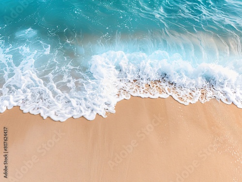 A wave approaches a sandy beach from a high vantage point