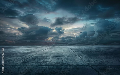 Dark Concrete Floor Background with Beautiful Night Skyline and Dramatic Clouds. stunning view