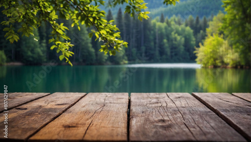 Nature's Haven, Wooden Tabletop Overlooking a Blur of Summer Lake and Green Forest